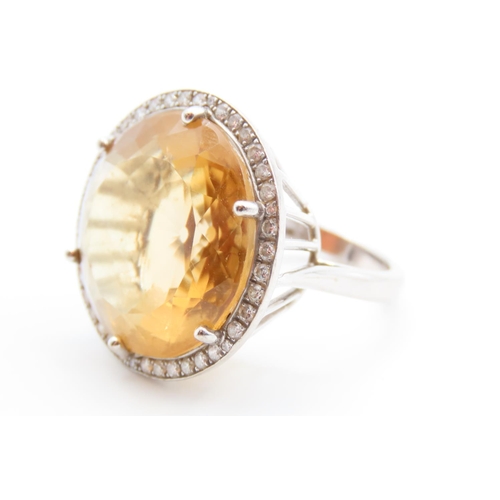 86 - Citrine Statement Ring with Diamond Halo set in 18 Carat White Gold Ring Size O