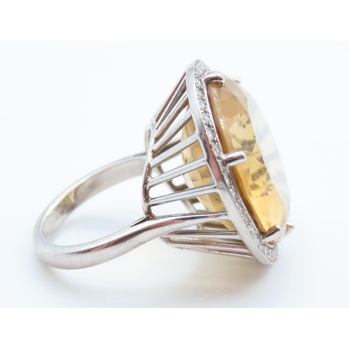 86 - Citrine Statement Ring with Diamond Halo set in 18 Carat White Gold Ring Size O