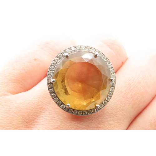 86 - Citrine Statement Ring with Diamond Halo set in 18 Carat White Gold Ring Size O