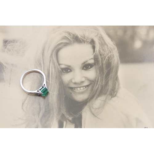 Emerald Centre Stone Ring Mounted in 18 Carat White Gold with Further Diamonds Set to Shoulders Ring Size M Lot Includes Original Photograph of Claudine Auger Illustrated,Bond Girl 'Thunderball' 1965