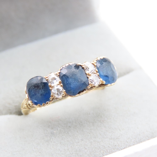 1437 - Three Stone Sapphire and Diamond Ring Line Set Mounted on 18 Carat Yellow Gold Band  Size L and a Ha... 