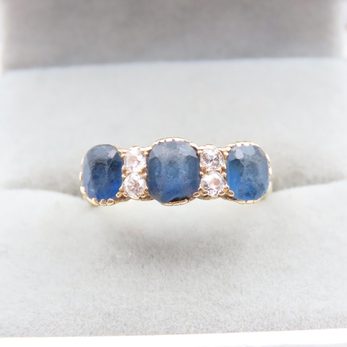 1437 - Three Stone Sapphire and Diamond Ring Line Set Mounted on 18 Carat Yellow Gold Band  Size L and a Ha... 