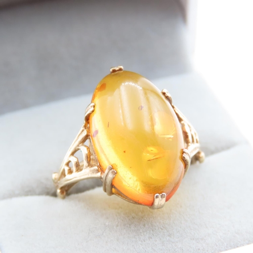 1448 - Basket Set Amber Statement Ring Mounted on 9 Carat Yellow Gold Ring Size R and a Half