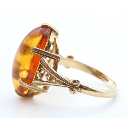 1448 - Basket Set Amber Statement Ring Mounted on 9 Carat Yellow Gold Ring Size R and a Half