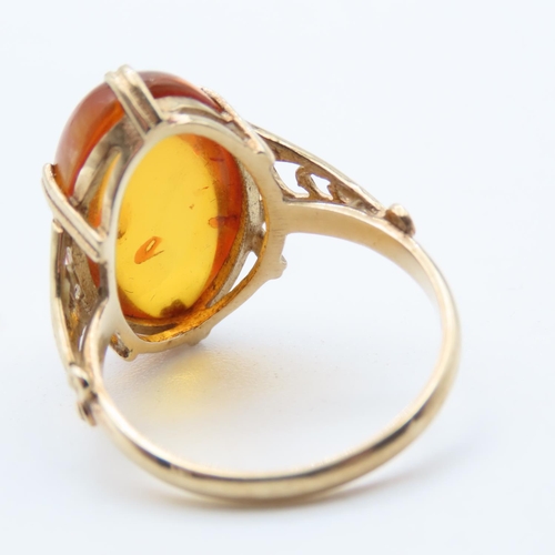 1448 - Basket Set Amber Statement Ring Mounted on 9 Carat Yellow Gold Ring Size R and a Half