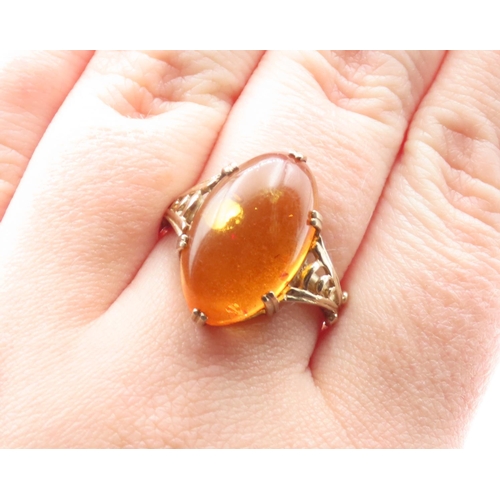 1448 - Basket Set Amber Statement Ring Mounted on 9 Carat Yellow Gold Ring Size R and a Half