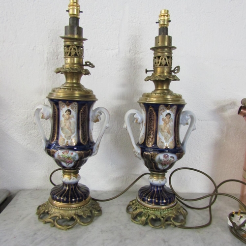 Large Pair of Antique Porcelain Ormolu Mounted Table Lamps with Cherrub Motif Decoration to Centres Each Electrified Working Order Each Approximately 18 Inches High