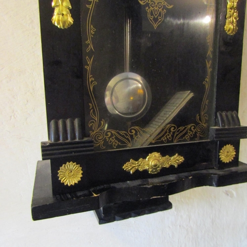 74 - Wall Clock gilded Ormolu Mounts Ebonised Case Approximately 24 Inches High