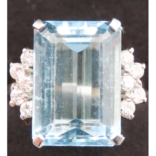 131 - Emerald Cut 12ct Aquamarine Statement Ring with Further Diamond Decoration to Shoulders Mounted on 1... 