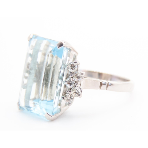 131 - Emerald Cut 12ct Aquamarine Statement Ring with Further Diamond Decoration to Shoulders Mounted on 1... 