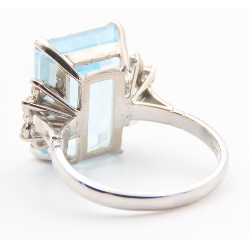 131 - Emerald Cut 12ct Aquamarine Statement Ring with Further Diamond Decoration to Shoulders Mounted on 1... 