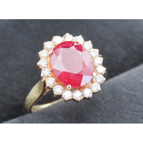 Ruby and Diamond Set Cluster Ring Mounted in 18 Carat Yellow Gold Total Ruby Weight Approximately 5ct Total Diamond Carat Weight 1.2ct Approximately Ring Size M and a Half