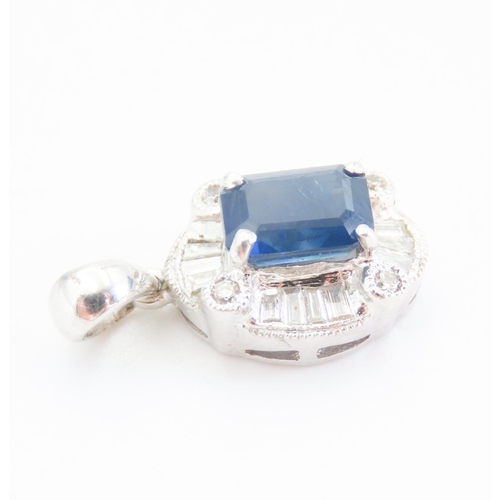 177 - Emerald Cut Sapphire Pendant with Tempered Baguette Diamond Surround Mounted in 18 Carat White Gold ... 