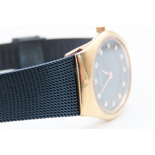 213 - Rose Gold and Navy Ladies BERING Wristwatch