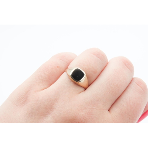 289 - Panel Set Black Onyx Signet Ring Mounted in 9 Carat Yellow Gold Ring Size O