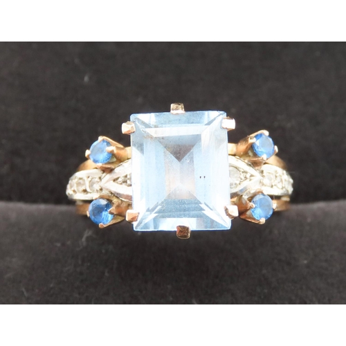 292 - Emerald Cut Aquamarine and Gemstone Set Ring Mounted in 18 Carat Yellow Gold Ring Size Q