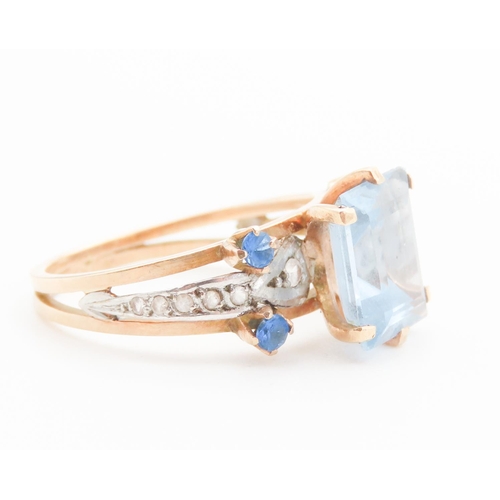 292 - Emerald Cut Aquamarine and Gemstone Set Ring Mounted in 18 Carat Yellow Gold Ring Size Q