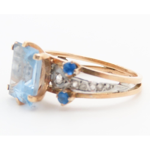 292 - Emerald Cut Aquamarine and Gemstone Set Ring Mounted in 18 Carat Yellow Gold Ring Size Q