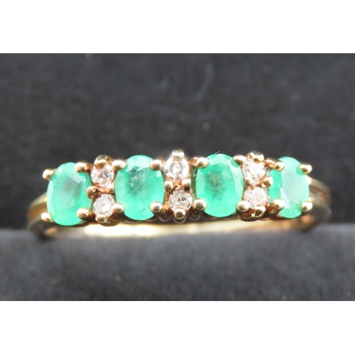 293 - Four Stone Emerald and Six Diamond Set Ring Mounted in 9 Carat Yellow Gold Ring Size Q and a Half