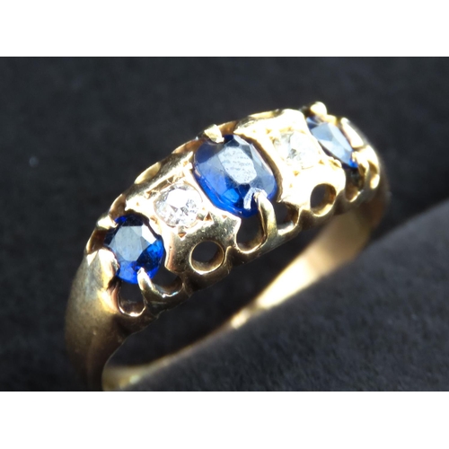 300 - Three Stone Sapphire and Diamond Set Ring Mounted in 18 Carat Yellow Gold Ring Size J