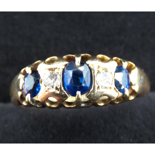 300 - Three Stone Sapphire and Diamond Set Ring Mounted in 18 Carat Yellow Gold Ring Size J