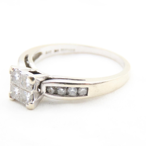 31 - Four Square Cut Diamond Ring with Further Diamonds Set to Shoulders Mounted in 18 Carat White Gold T... 