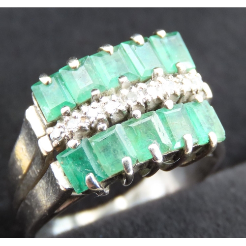 312 - Ten Stone Emerald and Diamond Set Ladies Ring Mounted in 18 Carat White Gold Ring Size K