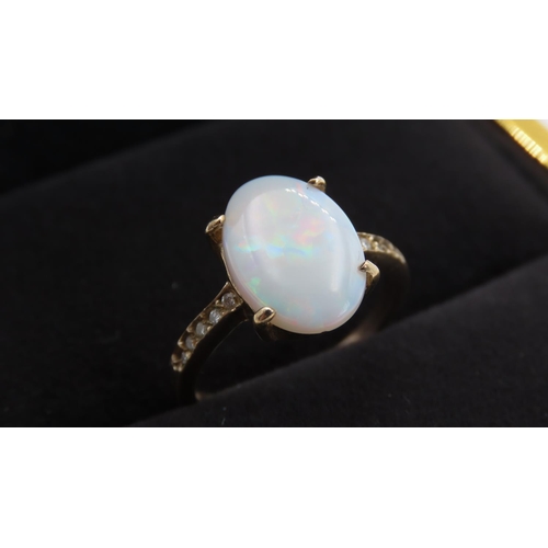 347 - Four Claw Set Opal Centre Stone Ring with Further Diamonds Set to Shoulders Mounted in 9 Carat Yello... 