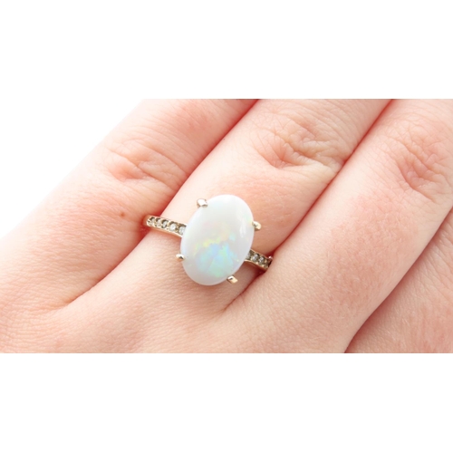 347 - Four Claw Set Opal Centre Stone Ring with Further Diamonds Set to Shoulders Mounted in 9 Carat Yello... 