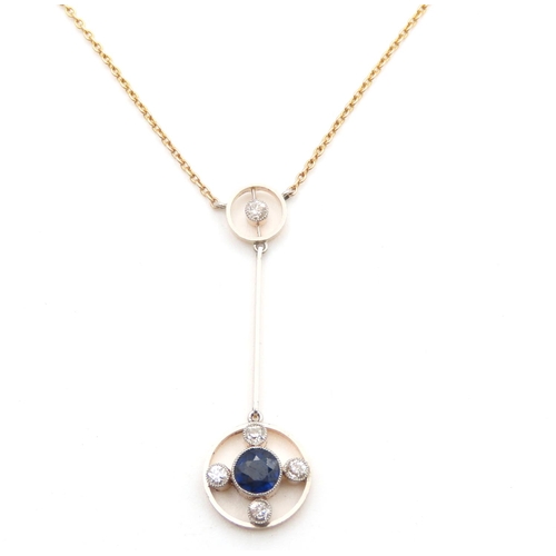 Ceylon Sapphire and Diamond Set Pendant Necklace Mounted in 15 Carat Yellow Gold Total Sapphire Carat Weight Approximately 0.80ct Total Diamond Carat Weight Approximately 0.50ct Chain 40cm Long Pendant 4cm Drop