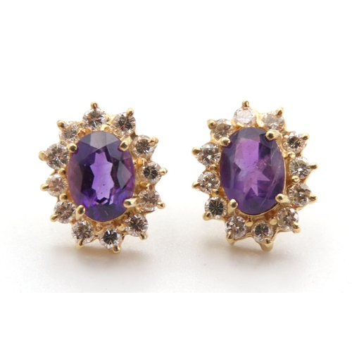 417 - Pair of 14 Carat Yellow Gold Amethyst and Diamond Set Cluster Earrings