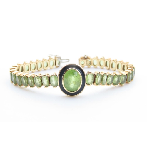 422 - 18 Carat Yellow Gold Peridot Set Bracelet with Bezel Set Centre Stone Black Enamel Detailing 16.5cm ... 