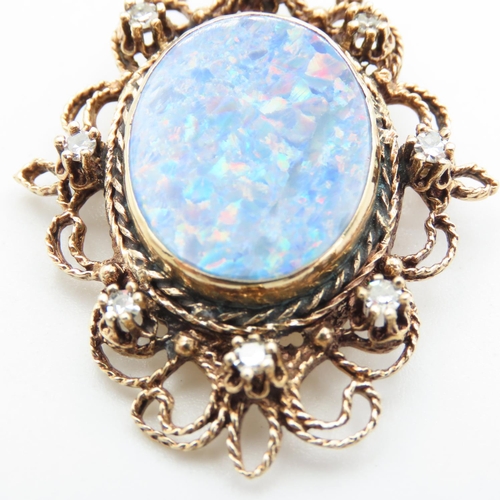 431 - Attractively Detailed Opal and Eight Diamond Set Brooch Mounted in 14 Carat Yellow Gold 5cm High