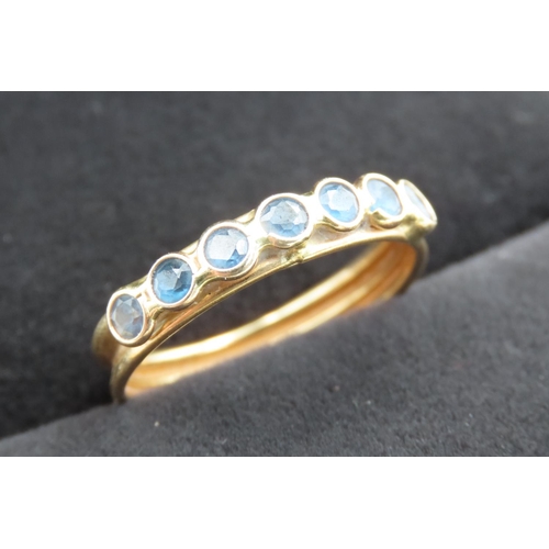 439 - Seven Stone Bezel Set Sapphire Ring Mounted in 18 Carat Yellow Gold Ring Size R