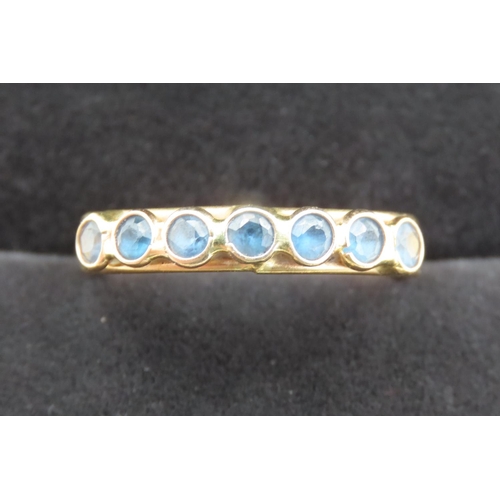 439 - Seven Stone Bezel Set Sapphire Ring Mounted in 18 Carat Yellow Gold Ring Size R