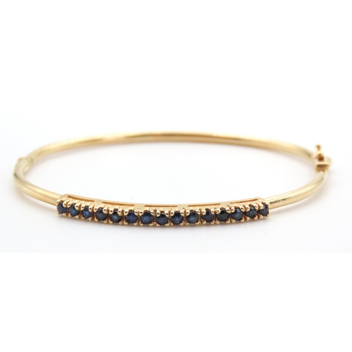 446 - Fifteen Stone Sapphire Set Bangle Mounted in 14 Carat Yellow Gold Inner Width 5.5cm