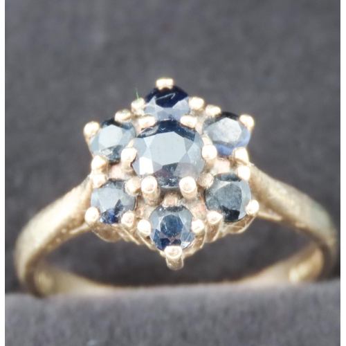 49 - Sapphire Seven Stone Daisy Motif Ladies Ring Mounted in 9 Carat Yellow Gold Ring Size P and a Half