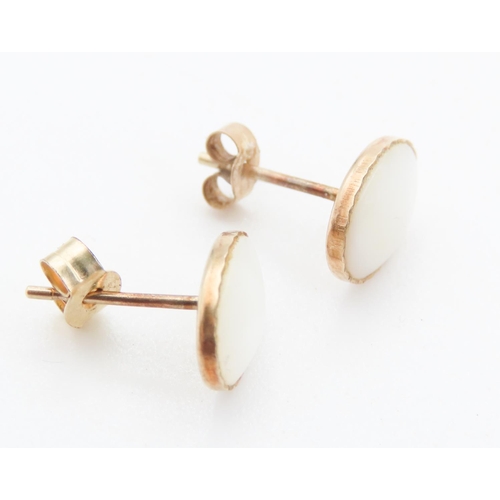 99 - Pair of 9 Carat Yellow Gold Mother of Pearl Set Earrings