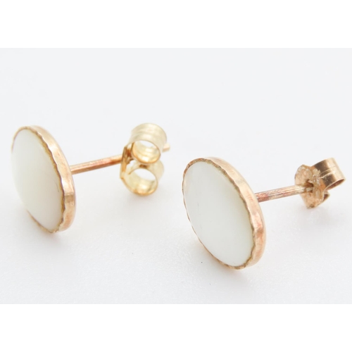 99 - Pair of 9 Carat Yellow Gold Mother of Pearl Set Earrings