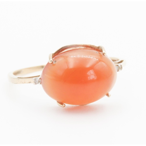 106 - Cabochon Amber Ring with Diamonds Set to Shoulders Mounted in 9 Carat Yellow Gold Ring Size V