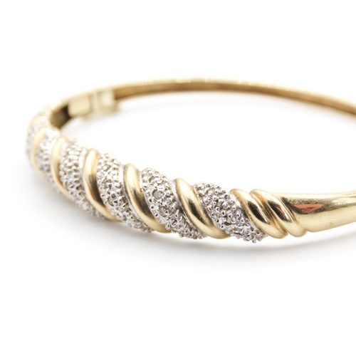 12 - Diamond Set Twist Form Bangle Mounted in 9 Carat Yellow Gold Inner Width 6cm