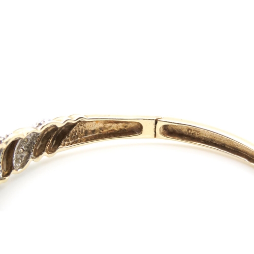 12 - Diamond Set Twist Form Bangle Mounted in 9 Carat Yellow Gold Inner Width 6cm