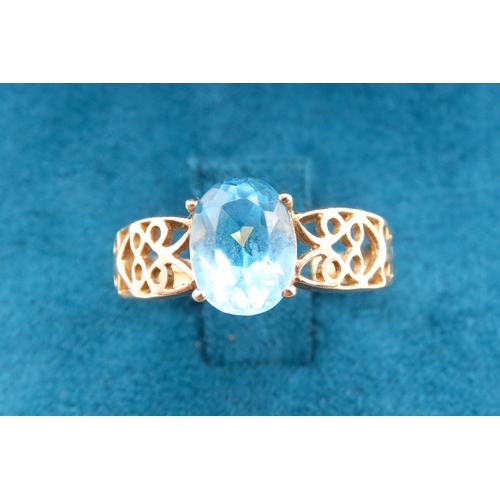 13 - Oval Cut London Blue Topaz Set Ring Mounted in 9 Carat Yellow Gold with Celtic Scroll Motif Decorati... 