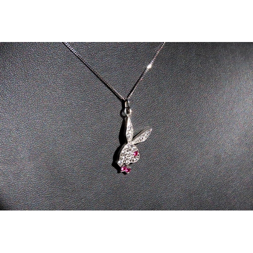 150 - Ruby and Gem Playboy Logo Pendant 3cm Drop Mounted on 9 Carat White Gold Chain 45cm Long