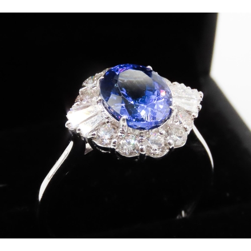 175 - 2.20 Carat Tanzanite Centerstone Ring with Tapered Baguette and Round Cut Diamond Surround Set in 18... 