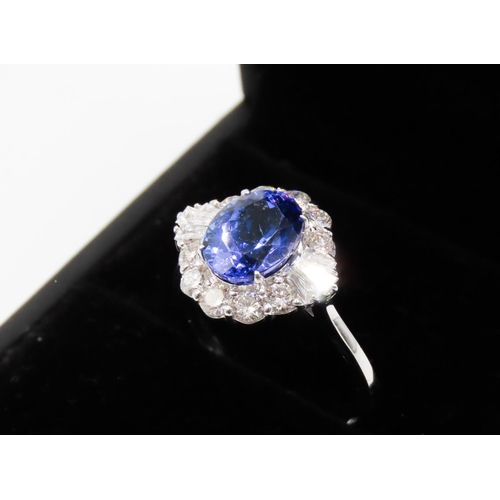 175 - 2.20 Carat Tanzanite Centerstone Ring with Tapered Baguette and Round Cut Diamond Surround Set in 18... 