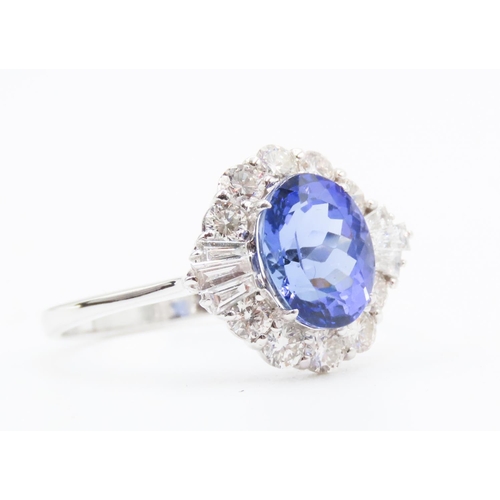 175 - 2.20 Carat Tanzanite Centerstone Ring with Tapered Baguette and Round Cut Diamond Surround Set in 18... 