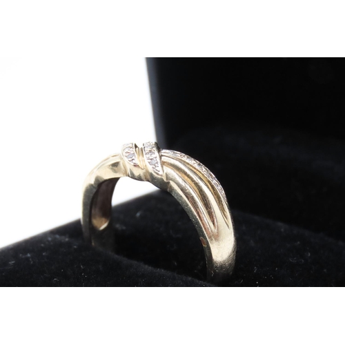 189 - Diamond Set Knot Motif Ring Mounted on 9 Carat Yellow Gold Ring Size R