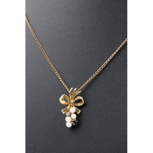 213 - Seed Pearl Sapphire and Diamond Set Bow Motif Pendant 1.5cm Drop Further Set on 9 Carat Yellow Gold ... 