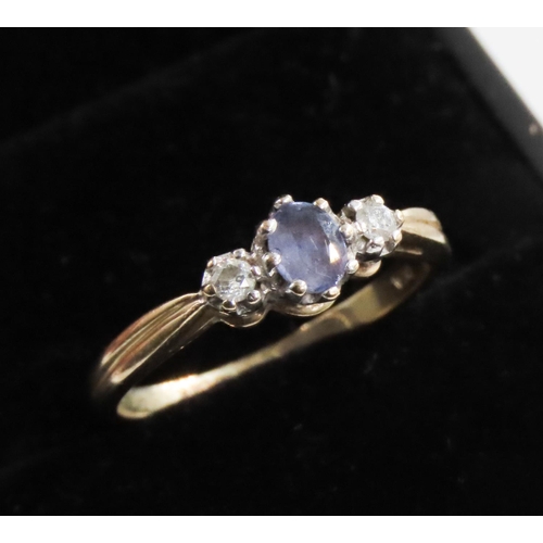 245 - Pale Tanzanite and Diamond Set Three Stone Ring Mounted in 9 Carat Yellow Gold Ring Size Q